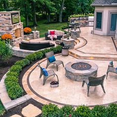 an outdoor patio with seating and fire pit