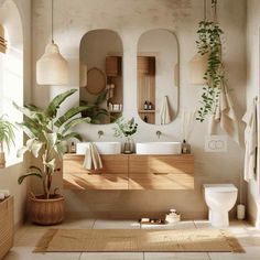 a bathroom with two sinks, mirrors and plants on the wall above the toilet area