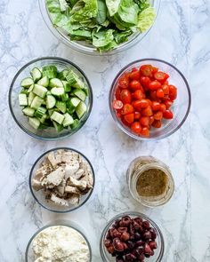 bowls filled with different types of food on top of a counter next to each other