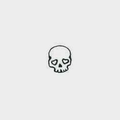 a black and white drawing of a skull