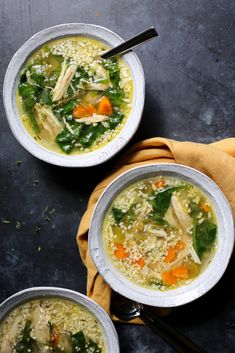 two bowls filled with soup on top of a table