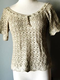 "Lovely KNITTED BEIGE DIRNDL TOP  with Short Sleeves Raglan Styles Interesting Knitting Pattern with various openings a Knitted Cord is woven in and out around the wide neckline by \"ST PETER TRACHTEN, AUSTRIA\" 67% Cotton/33% Polyacryl No Size label Actual Measurements are: armpit to armpit: 17\" (34\" bust) length: 20\" An airy, light top VINTAGE, in excellent condition" Cream Crochet Knit Top, Beige Hand Knitted Tops, Hand Knitted Cream Knit Tops, Cream Hand Knitted Top, Knitted Cord, St Peter, Cute Comfy Outfits, Top Vintage, Size Label