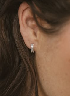 Show off your chic side when you sport these stunning heirloom baguette diamond huggie earrings from Liven. Whether you’re looking for the perfect piece of everyday luxury for the office, evening occasions, or anything in between, these must-have 14k gold Megan earrings are as versatile as they are va-voom. Material 14K White Gold Channel set baguette diamonds, framed by elegant diamond borders Three rows of hand set white diamonds Total diamond weight: 0.36ct Approximate internal diameter: 8.5m Classy Diamond Earrings, Elegant Earrings Classy, Everyday Diamond Earrings, Everyday Earrings Simple, Baguette Diamond Earrings, Baguette Earrings, Office Jewelry, Baguette Earring, Contemporary Fine Jewelry