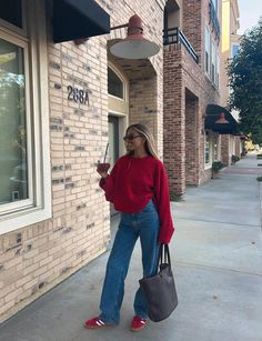 10 Easy Ways To Style Red Shoes This Season Madrid Spain Winter Outfits, Red Top Blue Jeans Outfit, New York Outfits Summer Tourist, Placement Outfits, Red Sambas, Digi Camera, Uni Fits, Looks Adidas, Adidas Samba Outfit