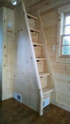 the stairs are made out of wood and have drawers under them