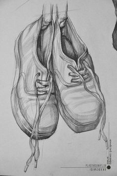 a drawing of two shoes hanging from a wire