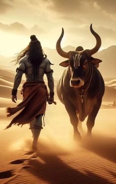 a man with long hair walking next to a bull in the desert