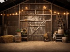 an old barn with hay bales and lights