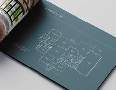 an open book showing plans for a house