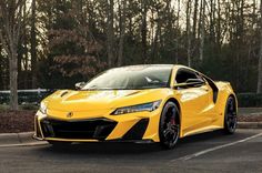 a yellow sports car parked in a parking lot