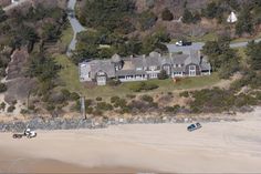 an aerial view of a house and beach