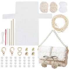 the contents of a white purse are shown in this image, including yarn, scissors and other accessories