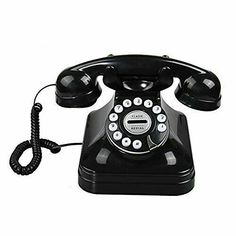 an old - fashioned black phone is shown on a white background