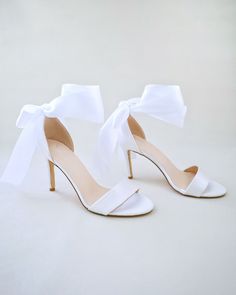 "Classic satin high heel sandals adorned adorned with matching satin or sheer ribbons that ties to an oversized bow around ankle to add dancerly grace to any ensemble. The light blue color can easily be your something blue. Simple and easy wear for bridal wear, bridesmaids, holiday party, wedding parties, and any special occasions.  DETAILS: HEEL HEIGHT: 3.5 Inches COLORS AVAILABLE: Ivory, Light Blue, Champagne, White, Fuchsia UPPER: Synthetic upper and lining MATERIALS: Manmade outsole STYLE NAME: DEMI Not sure of which size to purchase? Shoes measurements are as follow: (Please note measurements taken the length of inside of shoe from toe to heel). Size 6 - 9.25\" Size 7 - 9.5\" Size 8 - 9.75\" Size 9 - 10\" Size 10 - 10.25\" Size 11 - 10.5\" Please note all these info are intended for g Luxury White Satin Heels, Fuchsia Heels, Bridesmaids Shoes, Blue Champagne, Flower Girl Shoes, Bridal Flats, Wedding Shoes Bride, Something Blue Wedding, Satin Shoes