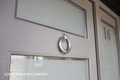 a close up of a door with a handle on the front and side glass doors