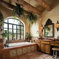 a bath room with a large tub next to a sink and a couple of mirrors