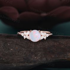 Vintage Opal engagement ring Unique rose gold opal engagement ring dainty bridal ring Marquise moissanite ring promise ring Anniversary gift ● Ring information: --main stone: Natural Opal --stone size & shaped: 6.5mm & round --side stones: Moissanite or Diamond --side stone weight: about 0.28ct ● Optional service: --personalized order --rush order & overnight --installment --engraving --gift box Please consult us for details ● Production and shipping time: We usually make the ring and arrange th Opal Engagement Ring Simple, Opalite Engagement Ring, Dainty Opal Ring For Wedding With Round Cut, Dainty Rose Gold Opal Ring For Wedding, Dainty Rose Gold Opal Wedding Ring, Rose Gold Opal Ring With Prong Setting, Simple Opal Ring, Boho Vintage Engagement Ring, Rose Gold Opal Engagement Ring