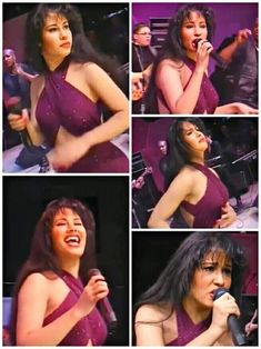 a woman in a purple dress singing into a microphone