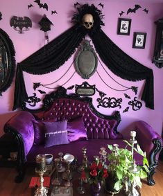 a living room decorated in purple and black