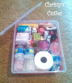 a plastic container filled with lots of different types of items on top of a carpet