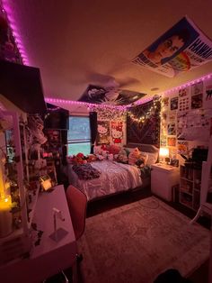 a bed room with a neatly made bed and lots of decorations on the wall above it