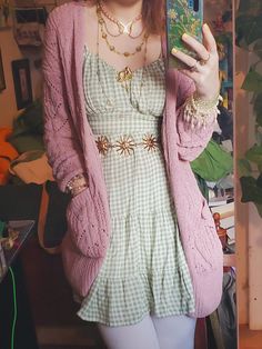 one of my favorite color combos :) pastel pink and pastel green, with white leggings to stay warm. most of my jewelry is made by me! tags: #cottage #cottagecore #pastel #green #pink #cardigan #diyjewellery #dress #picnic #gingham #cuteoutfit #sweet #spring #springfashion #springoutfit #selflove #fashion #selfietime Pastel Pink And Green Outfit, Pastel Boho Outfit, Pink And Green Cottagecore, Pastel Goblincore, Pink And Green Outfits, Pink Green Outfit, Green And Pink Outfit, Cottage Core Aesthetic Outfit, Witchcore Fashion