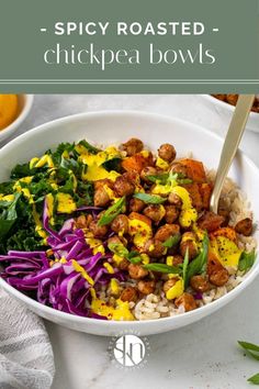 a white bowl filled with rice, meat and veggies on top of a table