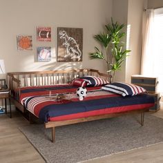 a bedroom with two beds and a soccer ball on the bed