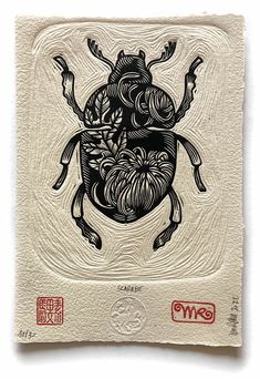 a black and white drawing of a beetle on a piece of paper with chinese writing