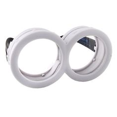 two white circular lights on a white background