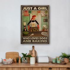 a woman who loves dogs and baking poster hangs on the wall above a wooden dresser