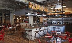 the inside of a restaurant with lots of tables and chairs