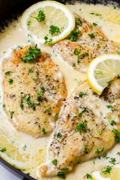 chicken with lemons and parsley in a skillet