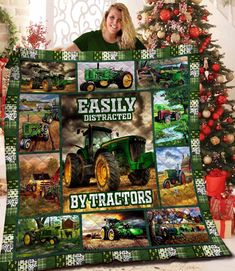 a woman holding up a blanket with tractors on it