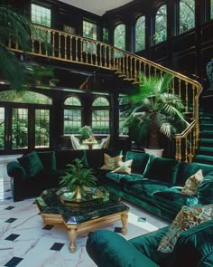 a living room filled with green couches next to a spiral stair case covered in plants