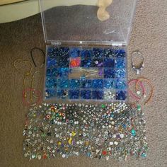 there are many beads in the box on the floor