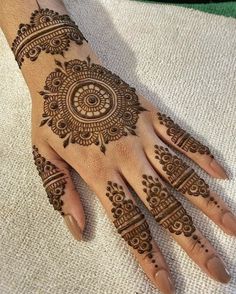 a henna tattoo on someone's hand