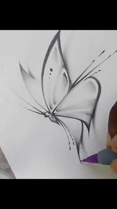 a drawing of a butterfly on a sheet of paper