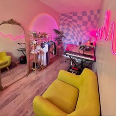 a living room filled with furniture next to a neon pink wall and piano keyboard in the corner