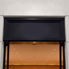 a store front with a clock on it's side