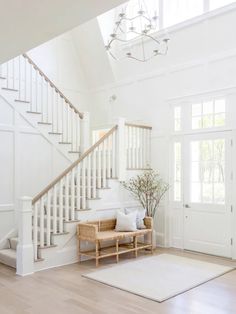 a living room filled with furniture and white walls