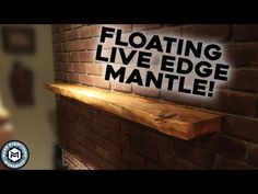 floating live edge mantle with text on brick wall