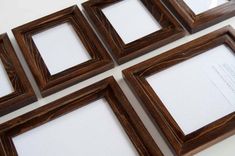 four wooden frames sitting next to each other