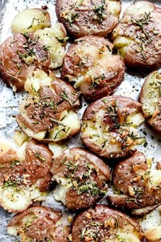 baked potatoes with herbs and seasoning on top