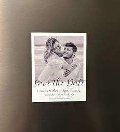 save the date magnet on a refrigerator door