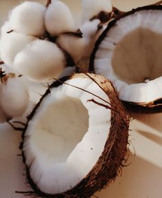 two halves of coconuts and one half cut open