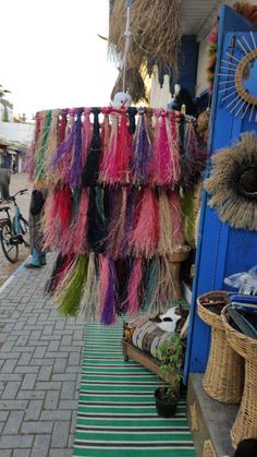 there are many colorful items on display at the market