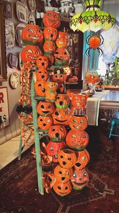 there are many pumpkins on display in this room and one is made out of wood