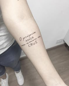 a woman with a tattoo on her arm that says, i am not crazy about the meaning