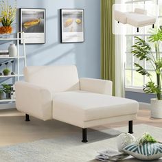 a living room scene with focus on the chaise lounger and potted plants